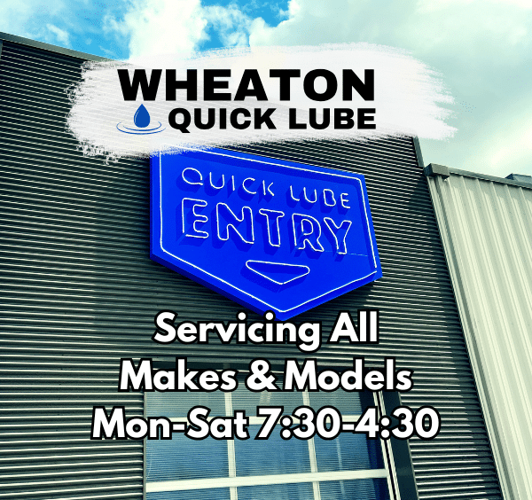 "Wheaton Quick Lube signage with service hours and entry sign, offering auto services Mon-Sat 7:30-4:30."