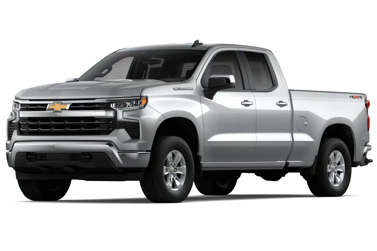 Silver Chevrolet Silverado pickup truck showcasing a modern design with a sleek front grille and prominent headlights, featuring a spacious double cab for enhanced comfort and utility. Ideal for both work and recreation, equipped with four-wheel drive for improved off-road performance.