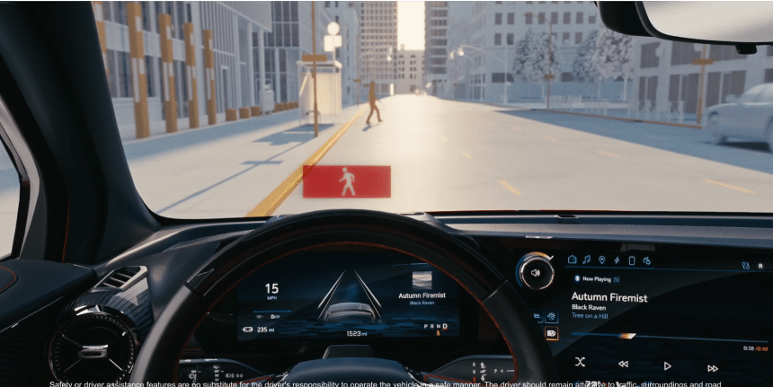 Car's dashboard view showing a pedestrian detection alert on an urban street.
